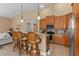 Spacious kitchen with granite countertops, wood cabinets, and stainless steel appliances at 4410 Turnberry Cir, North Port, FL 34288