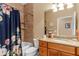 Clean bathroom with shower/tub combo and floral shower curtain at 4410 Turnberry Cir, North Port, FL 34288