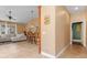 Open living room and kitchen with tile flooring and vaulted ceilings at 4410 Turnberry Cir, North Port, FL 34288