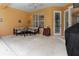 Spacious patio with comfortable seating and grill at 4410 Turnberry Cir, North Port, FL 34288