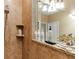 Modern bathroom with a walk-in shower and granite vanity at 4410 Turnberry Cir, North Port, FL 34288