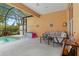 Inviting pool area with covered patio and seating at 4410 Turnberry Cir, North Port, FL 34288