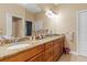 Elegant bathroom with double vanity and granite countertops at 4410 Turnberry Cir, North Port, FL 34288