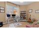 Home office with built-in shelving and plenty of natural light at 4410 Turnberry Cir, North Port, FL 34288