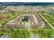 Aerial view of community with pond and surrounding houses at 4410 Turnberry Cir, North Port, FL 34288