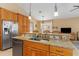 Kitchen island with granite countertops and a built-in sink at 4410 Turnberry Cir, North Port, FL 34288
