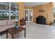 Relaxing patio with seating area and built-in grill at 4410 Turnberry Cir, North Port, FL 34288