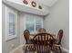 Charming breakfast nook with a round table and four chairs at 19310 Water Oak Dr # 203, Port Charlotte, FL 33948