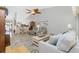 Open living room with hardwood floors and ceiling fan at 19310 Water Oak Dr # 203, Port Charlotte, FL 33948