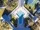 Community pool with surrounding lounge chairs at 19310 Water Oak Dr # 203, Port Charlotte, FL 33948