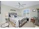 Charming bedroom with a queen-size bed and window seating at 19310 Water Oak Dr # 203, Port Charlotte, FL 33948
