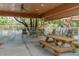 Covered patio with picnic tables and seating at 19310 Water Oak Dr # 203, Port Charlotte, FL 33948
