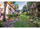 Lush landscaping surrounds the building, creating a tranquil and serene environment at 19310 Water Oak Dr # 203, Port Charlotte, FL 33948