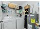 Convenient laundry room with washer, dryer, and shelving at 19310 Water Oak Dr # 203, Port Charlotte, FL 33948