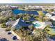 Aerial view of community pool, tennis courts, and clubhouse at 19310 Water Oak Dr # 203, Port Charlotte, FL 33948