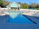 Relaxing community pool with plenty of lounge chairs at 19310 Water Oak Dr # 203, Port Charlotte, FL 33948