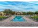 Resort-style pool with lounge chairs and covered seating at 19310 Water Oak Dr # 203, Port Charlotte, FL 33948