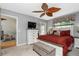 Comfortable bedroom with king-size bed, dresser, and access to balcony at 19310 Water Oak Dr # 203, Port Charlotte, FL 33948
