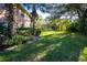Well-manicured lawns and tropical foliage create a beautiful outdoor space at 19310 Water Oak Dr # 203, Port Charlotte, FL 33948