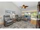 Relaxing living room with gray armchairs and a sofa at 19310 Water Oak Dr # 203, Port Charlotte, FL 33948
