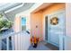 Condo front entry with wreath and balcony at 19310 Water Oak Dr # 203, Port Charlotte, FL 33948