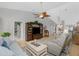 Living room with hardwood floors and a large TV stand at 19310 Water Oak Dr # 203, Port Charlotte, FL 33948