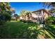 Two-story building with balconies and lush landscaping at 19310 Water Oak Dr # 203, Port Charlotte, FL 33948