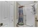 Clean bathroom with shower, toilet, and storage at 19310 Water Oak Dr # 203, Port Charlotte, FL 33948