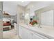 Double vanity bathroom with view of bedroom at 19310 Water Oak Dr # 203, Port Charlotte, FL 33948
