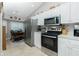 Kitchen features stainless steel appliances and breakfast nook at 19310 Water Oak Dr # 203, Port Charlotte, FL 33948