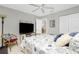Comfortable bedroom with a queen-size bed and flat-screen TV at 19310 Water Oak Dr # 203, Port Charlotte, FL 33948