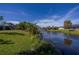 Serene backyard with canal views and lush greenery at 22532 Ashton Ave, Punta Gorda, FL 33980