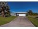 Single-story home with attached garage and driveway at 22532 Ashton Ave, Punta Gorda, FL 33980