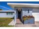 Front entrance with a gray planter and a walkway leading to the front door at 22532 Ashton Ave, Punta Gorda, FL 33980