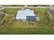 Aerial view of the house, highlighting the pool and lush landscaping at 2363 Homestead Cir, North Port, FL 34286