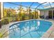 Refreshing pool surrounded by a screened patio at 2363 Homestead Cir, North Port, FL 34286