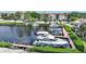 Private boat dockage with several boats and lush landscaping at 25188 Marion Ave # B309, Punta Gorda, FL 33950