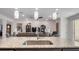 Modern kitchen with granite island and view of living room at 2705 Lamkin Rd, North Port, FL 34288