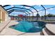 Inviting pool with covered patio and multiple seating areas at 2705 Lamkin Rd, North Port, FL 34288