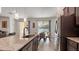 Modern kitchen with stainless steel appliances and view of pool at 2705 Lamkin Rd, North Port, FL 34288