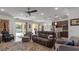 Living room with pool view and comfortable seating at 2705 Lamkin Rd, North Port, FL 34288