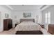 Spacious main bedroom with large bed and ensuite bathroom at 2705 Lamkin Rd, North Port, FL 34288