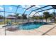 Relaxing pool area with covered patio, spa, and water features at 2705 Lamkin Rd, North Port, FL 34288