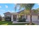 One-story home with stone accents and palm trees at 2705 Lamkin Rd, North Port, FL 34288