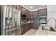 Modern kitchen with stainless steel appliances and granite countertops at 2705 Lamkin Rd, North Port, FL 34288