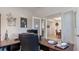 Bright home office features built-in desk and view into dining room at 2705 Lamkin Rd, North Port, FL 34288