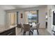 Breakfast nook with glass table and view of the pool at 2705 Lamkin Rd, North Port, FL 34288