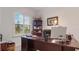 Home office with desk, window, and built-in shelving at 2705 Lamkin Rd, North Port, FL 34288