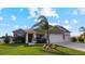 Single-Gathering home with stone facade and two-car garage at 2705 Lamkin Rd, North Port, FL 34288