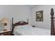 Bedroom with a queen-size bed and a framed painting at 2705 Lamkin Rd, North Port, FL 34288